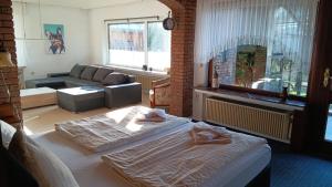 a living room with two beds and a couch at Ferienhaus Strandlöper Reiners in Horumersiel