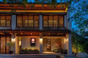 an exterior view of a house at night at 垣里民宿The hotel under the city wall in Xi'an