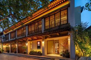 a building with large windows on the side of it at 垣里民宿The hotel under the city wall in Xi'an