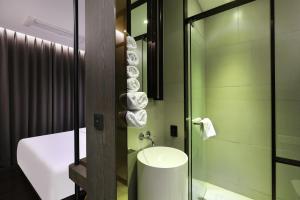 a bathroom with a toilet and a sink and a shower at Pangyo KYND Tourist Hotel - Foreign Tourist Tax Return Hotel in Seongnam +88 photos