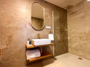 a bathroom with a sink and a shower at Vila Černý leknín in Tábor