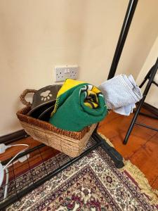 a basket sitting on a rack on top of a rug at The Lodge in Prickwillow