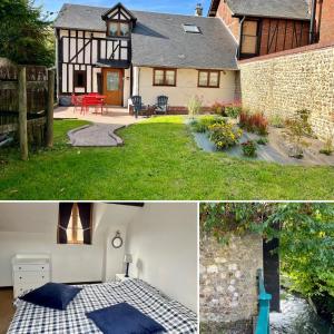 a house with a picnic table in the yard at Maison de centre-village "Au bord de l'Ô" - Jardin - Parking in Cormeilles