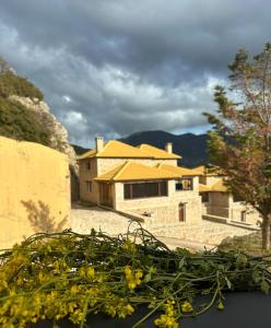 a view of a house from a window at Veranda Villa in Arachova
