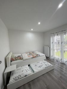 Postel nebo postele na pokoji v ubytování Ferienwohnung Gani - Kißlegg + 14 fotografií