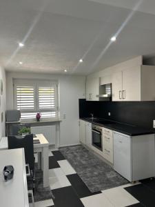 Kuchyň nebo kuchyňský kout v ubytování Ferienwohnung Gani - Kißlegg