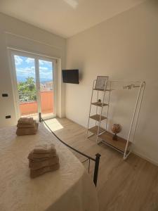 a room with a bed and a ladder and a window at Pasu B&B in Burgos