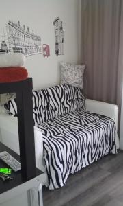 
A bed or beds in a room at Apartment Garsonierka v Krasnogorske
