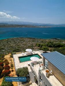 an aerial view of a house with a swimming pool at Seacrete villas in Chania