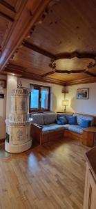a living room with a couch and a table at La Casa della Nonna in San Vito di Cadore +11 photos