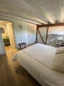 a bedroom with a large white bed in a room at El Molino del Burgo de Osma in El Burgo de Osma +28 photos