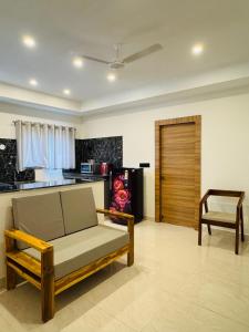a living room with a couch and a table at Bigson Skyara Apart Hotel in Hyderabad