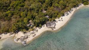 an aerial view of a beach with trees and water at SOWK Resort in Baan Khai