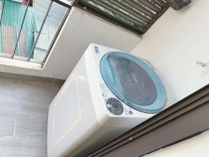 a washing machine sitting next to a window at Sông Tranh 402MD in Hanoi