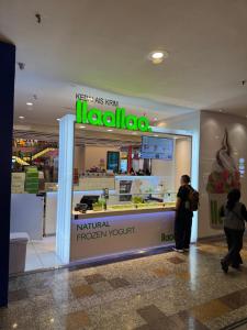 a store with people standing in front of a counter at BBS Suites At Times Square in Kuala Lumpur +114 photos