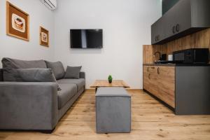 a living room with a couch and a table at T7 Aparthotel in Rivne