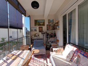a living room with a couch and a balcony at side side in Side