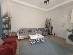 a living room with a couch and a coffee table at side side in Side