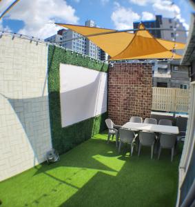 En terrasse eller udendørsområde på stayaroma