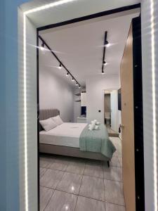 a bedroom with a large bed in a room at Family Luxury Suite by Zeus Suites in Athens