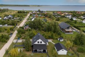 an aerial view of a small village with houses at Baltic Home Houses Zastań with Parking by Noclegi Renters in Zastań +48 photos