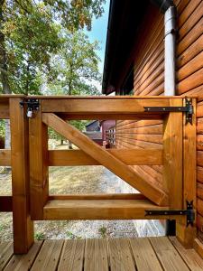 a wooden gate on a porch of a house at South Soul Cottage in Somme-Leuze +59 photos