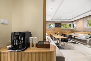 a living room with a coffee maker on a counter at Molo Residence in Sopot