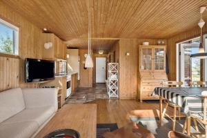 a living room with a couch and a table at OH511-Hadsund-Halvrebene-36 in Hadsund