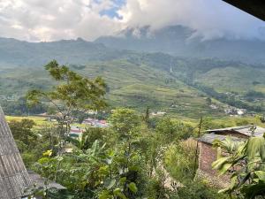 a view of a valley with a mountain in the background at Eco green Homestay in Sa Pa