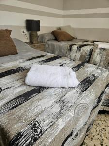 Postel nebo postele na pokoji v ubytování MEQUEDO Avenida Aragon 91