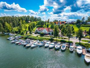 an aerial view of boats docked in a harbor at Amax Boutique Hotel in Mikołajki