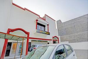 a car parked in front of a fuel station at Hotel O Friday's in Bathinda