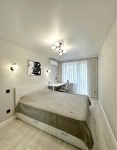 Giường trong phòng chung tại Boutique apartment Most City Area