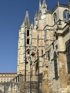 an old building with a tower of a cathedral at VictrixHomes in León