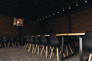 a row of chairs in a room with a television at Dravis Event Park  +37 photos