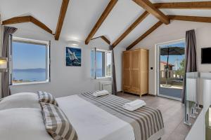 Katil atau katil-katil dalam bilik di Villa Toni - Makarska Exklusiv +22 gambar
