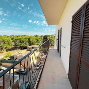 a balcony of a house with a view at Mallorca Suites Playa De Palma in Palma de Mallorca