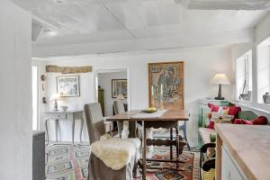 a kitchen and dining room with a table and chairs at 5580-Svaneke-Mor-Markers-Gaenge-13 in Svaneke