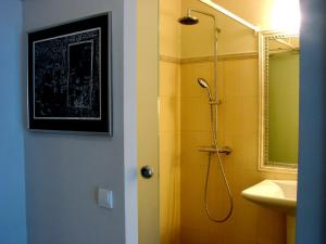 a bathroom with a shower and a sink at Atelier Aleksandry in Gdynia +37 photos