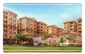 an image of a large apartment building at Gardinia City Apartment in Cairo