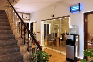 a room with a staircase with a refrigerator in it at Grand Peace House II in Islamabad
