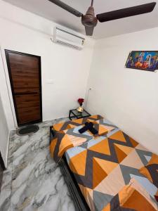 a bedroom with a large bed in a room at Enclave Villa 4BHK in Lonavala