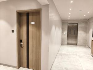 a hallway with a wooden door in a building at Chandi Haveli Hotel  +7 photos