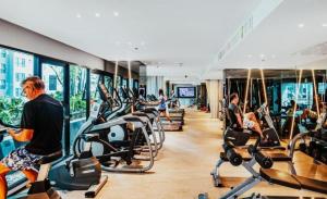 a group of people exercising in a gym at The base Central Pattaya 2 bedrooms in Pattaya Central