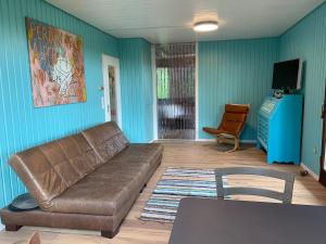 TV a/nebo společenská místnost v ubytování Holzhaus Devils Corner