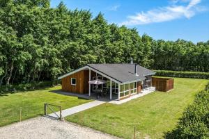 a small cabin in the middle of a yard at OH127-Storvorde-Havornen-6 in Storvorde