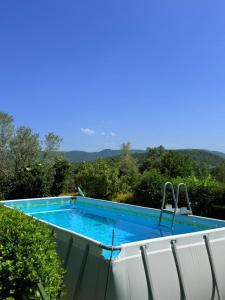 a swimming pool on the side of a house at Casa Petra in Morillo de Monclús