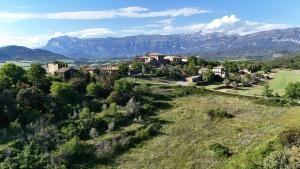 an aerial view of a village with mountains in the background at Casa Petra in Morillo de Monclús