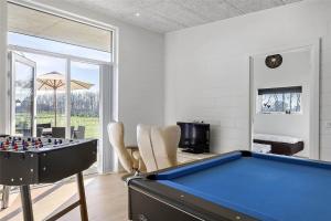 a pool table in a living room with a pool table at OH306-Hadsund-Ridestien-3 in Hadsund