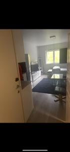 a living room with a bed and a table at Joy Vulcan Center apartment in Oslo